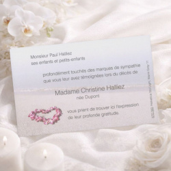 Carte remerciement après funérailles fleurs rose en bord de mer